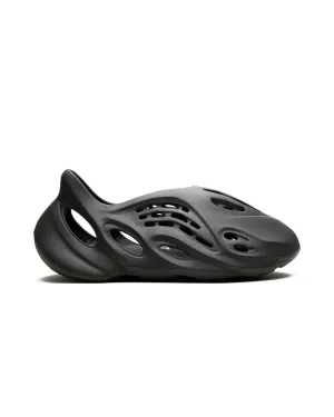 running in a lagoon area shoes adidas Yeezy Foam RNR Carbon